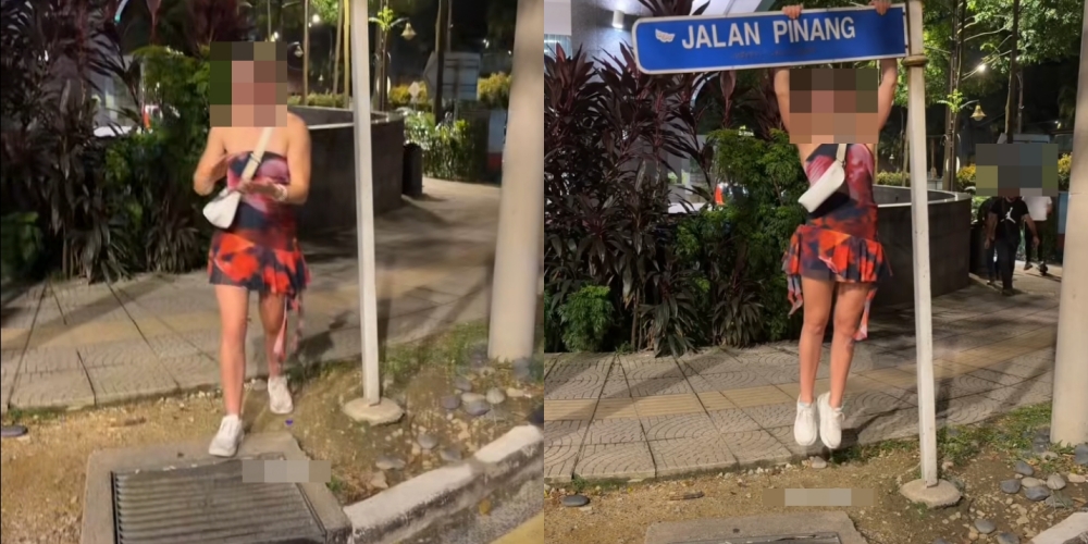 Pelancong Wanita Bergayut Pada Papan Tanda Sehingga Bengkok, Warga Tempatan Berang